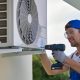 man with a tool doing HVAC maintenance